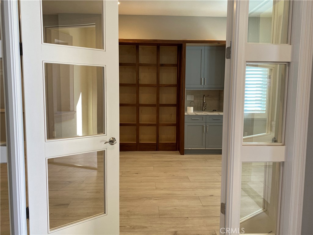 107 Iron Gate Irvine, CA 92618 - Photo 14 of 37 a view of an empty room with cabinet and a window