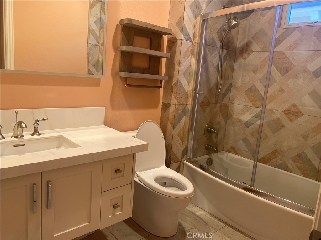 107 Iron Gate Irvine, CA 92618 - Photo 22 of 37 a bathroom with a sink a toilet and shower