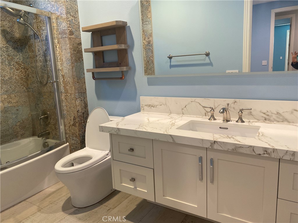 107 Iron Gate Irvine, CA 92618 - Photo 24 of 37 a bathroom with a granite countertop sink toilet and shower