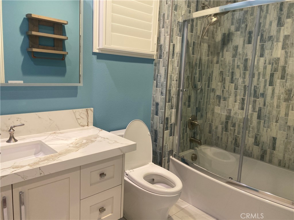 107 Iron Gate Irvine, CA 92618 - Photo 26 of 37 a bathroom with a sink a toilet and shower