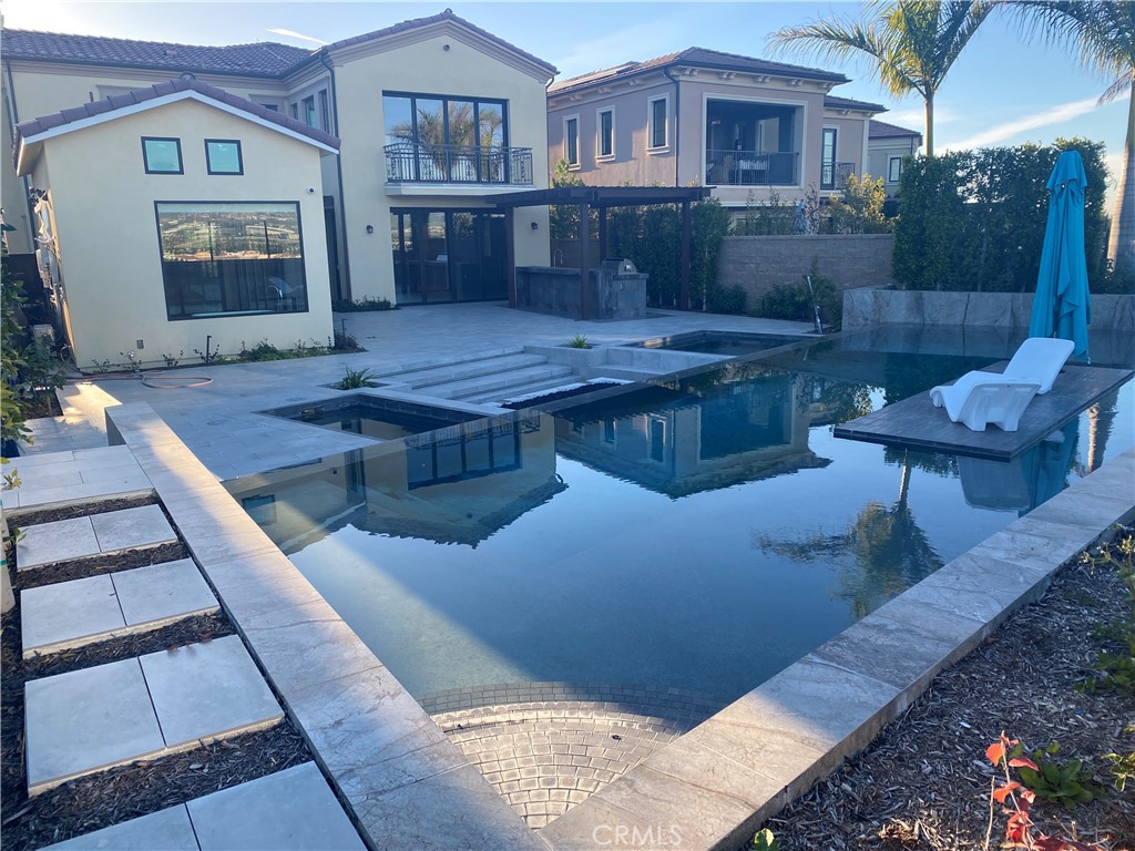 107 Iron Gate Irvine, CA 92618 - Photo 30 of 37 a view of a house with backyard and sitting area