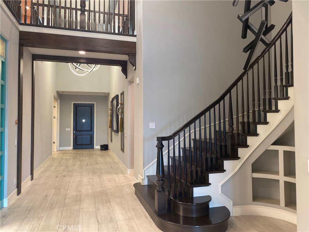 107 Iron Gate Irvine, CA 92618 - Photo 3 of 37 a view of entryway and hall with wooden floor