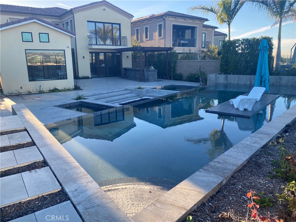107 Iron Gate Irvine, CA 92618 - Photo 31 of 37 a living room with furniture and a fireplace