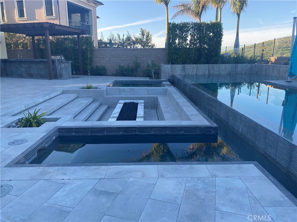 107 Iron Gate Irvine, CA 92618 - Photo 32 of 37 a view of backyard with outdoor seating