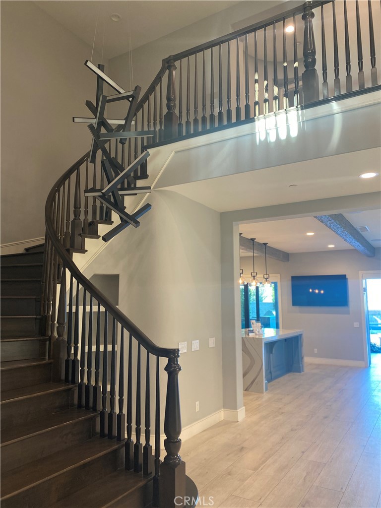 107 Iron Gate Irvine, CA 92618 - Photo 4 of 37 a view of entryway and hall with wooden floor
