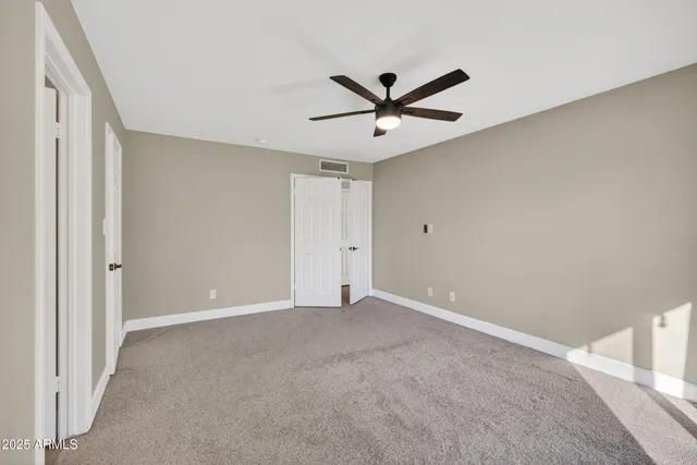a view of a big room with carpet