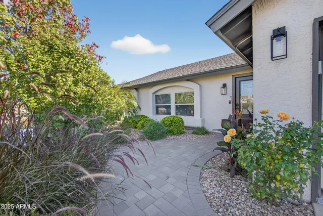 a front view of a house with garden