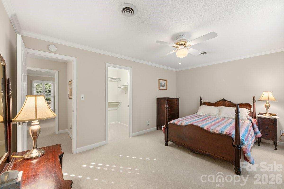 207 Lost Corner Road Morganton, NC 28655 - Photo 39 of 46 a bedroom with a bed and a chandelier