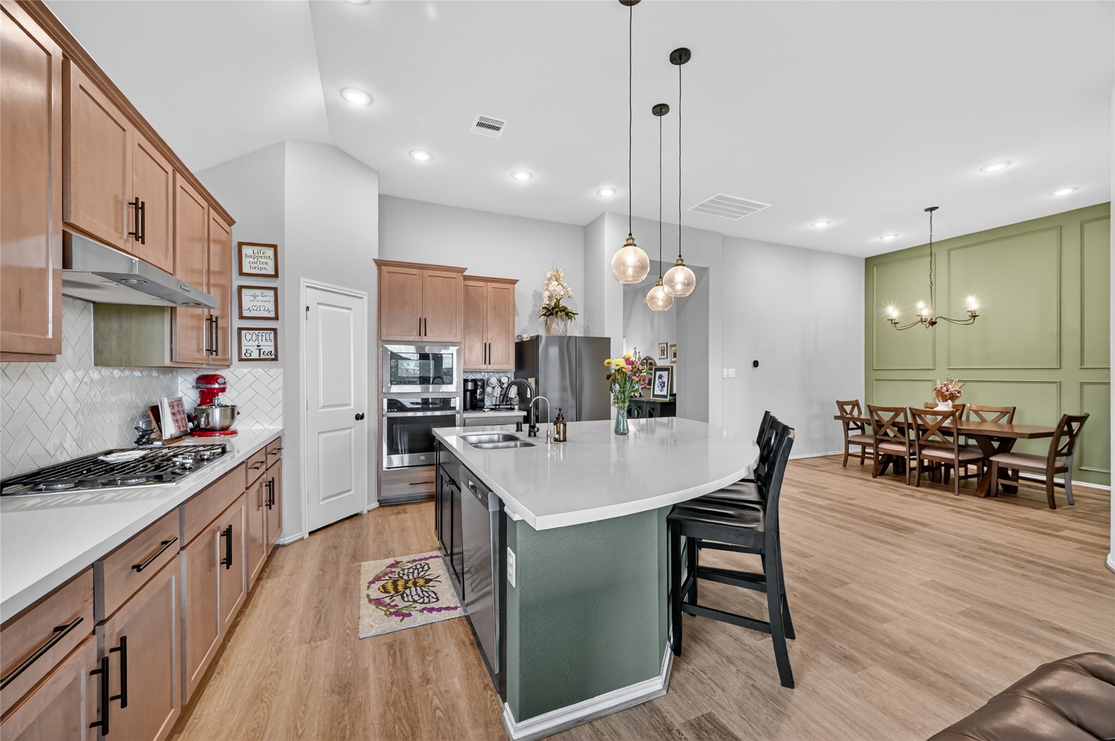 4731 Cedar Butte Lane Manvel, TX 77578 - Photo 11 of 42 a large kitchen with a table and chairs