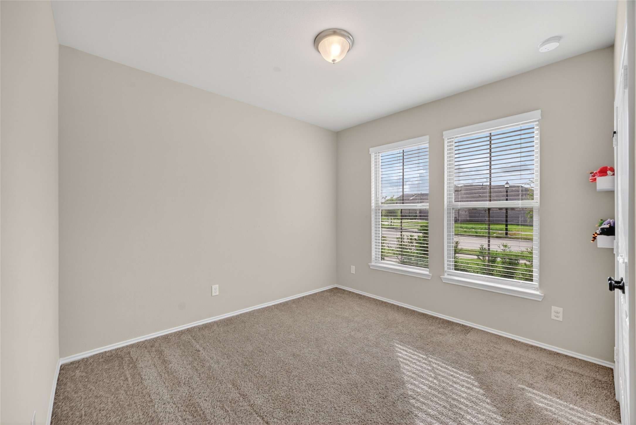 4731 Cedar Butte Lane Manvel, TX 77578 - Photo 25 of 42 a view of an empty room with a window