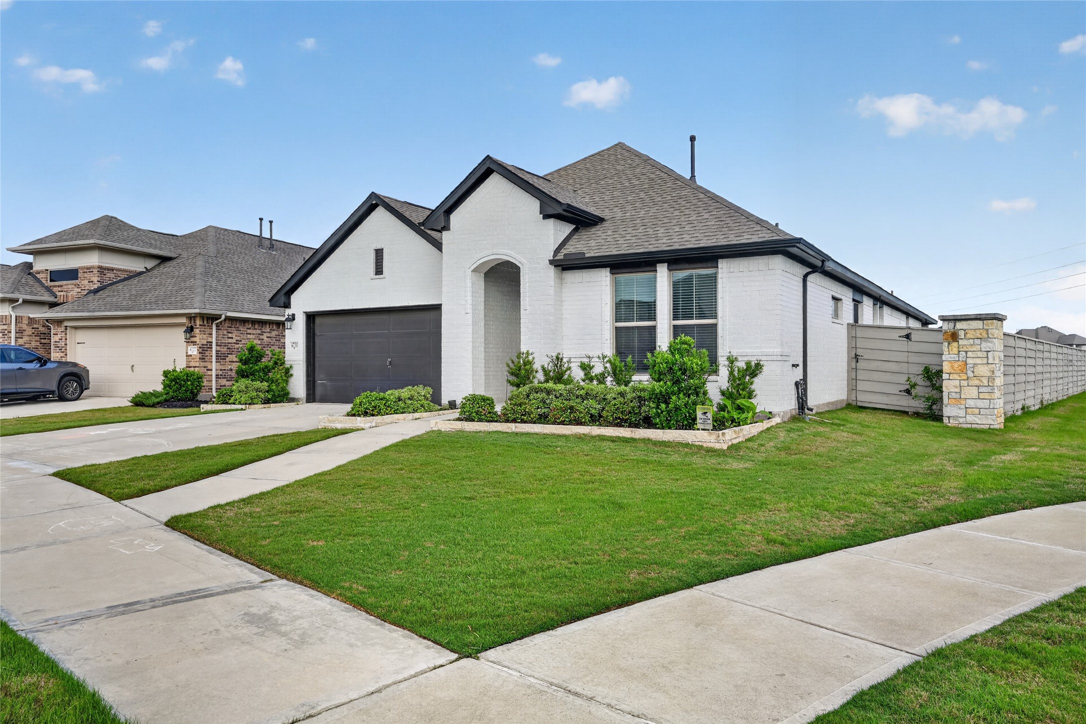 4731 Cedar Butte Lane Manvel, TX 77578 - Photo 3 of 42 a front view of a house with a yard and potted plants