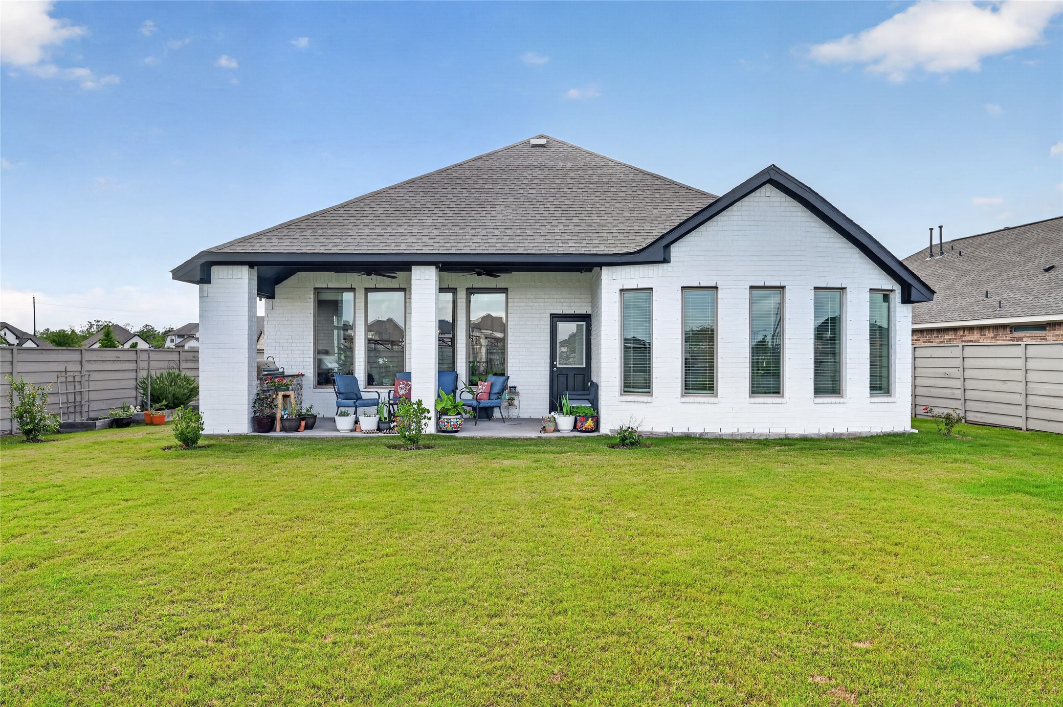 4731 Cedar Butte Lane Manvel, TX 77578 - Photo 35 of 42 a view of a house with a yard and sitting area