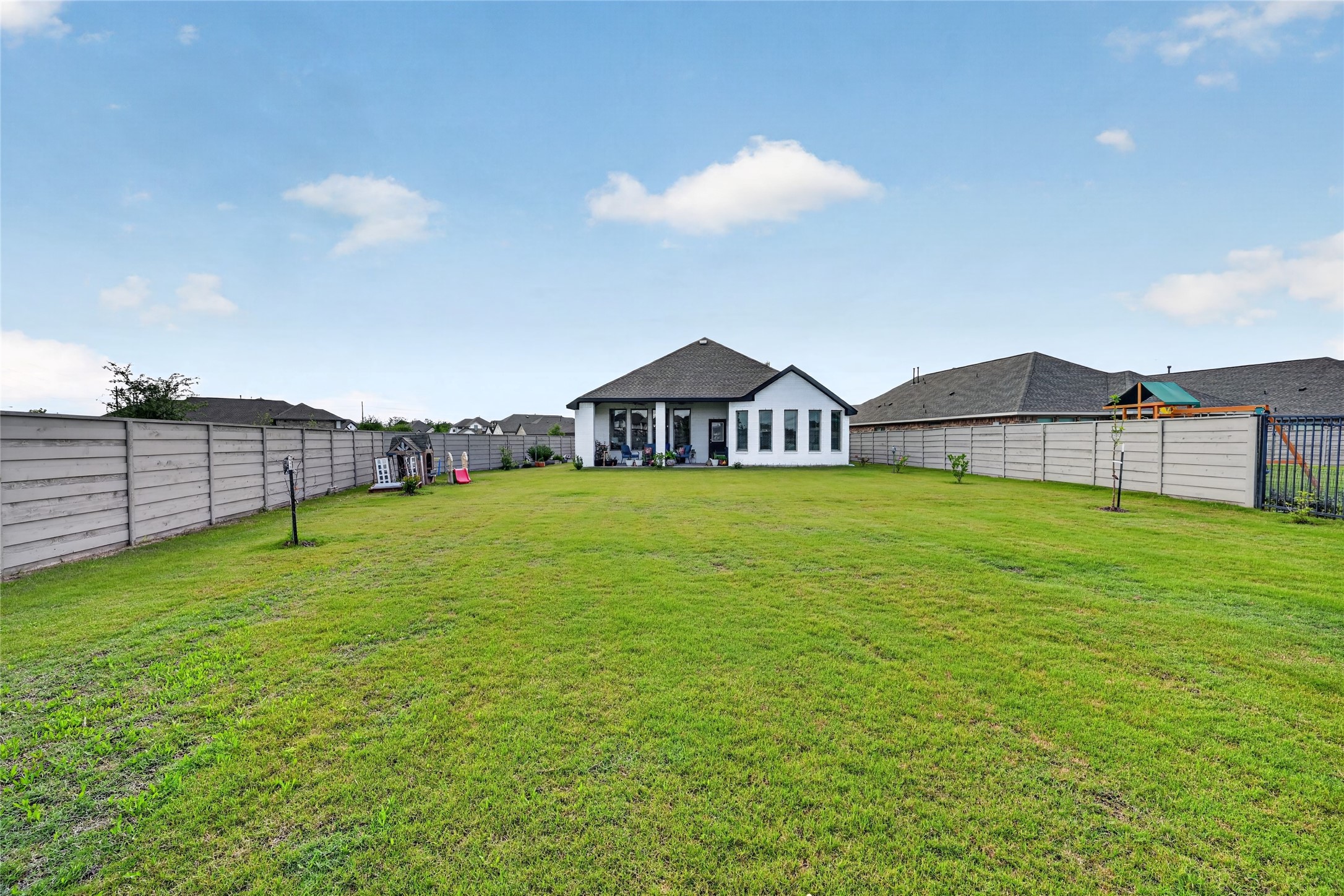 4731 Cedar Butte Lane Manvel, TX 77578 - Photo 42 of 42 a view of a house with a backyard