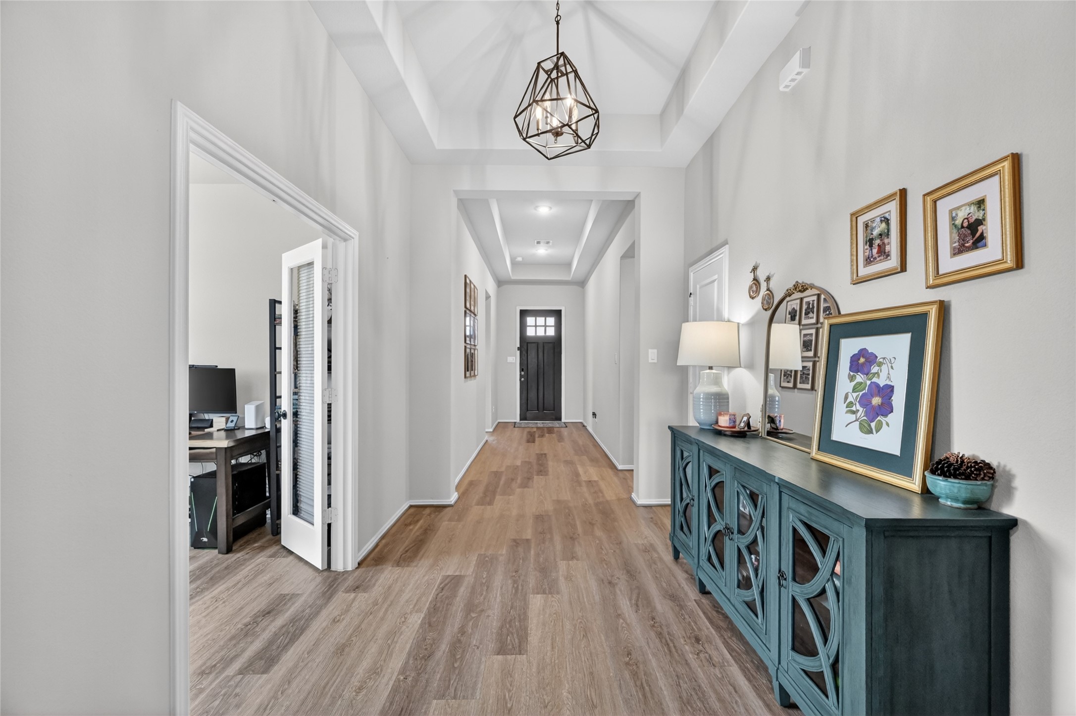 4731 Cedar Butte Lane Manvel, TX 77578 - Photo 5 of 42 a view of a hallway view with wooden floor and staircase
