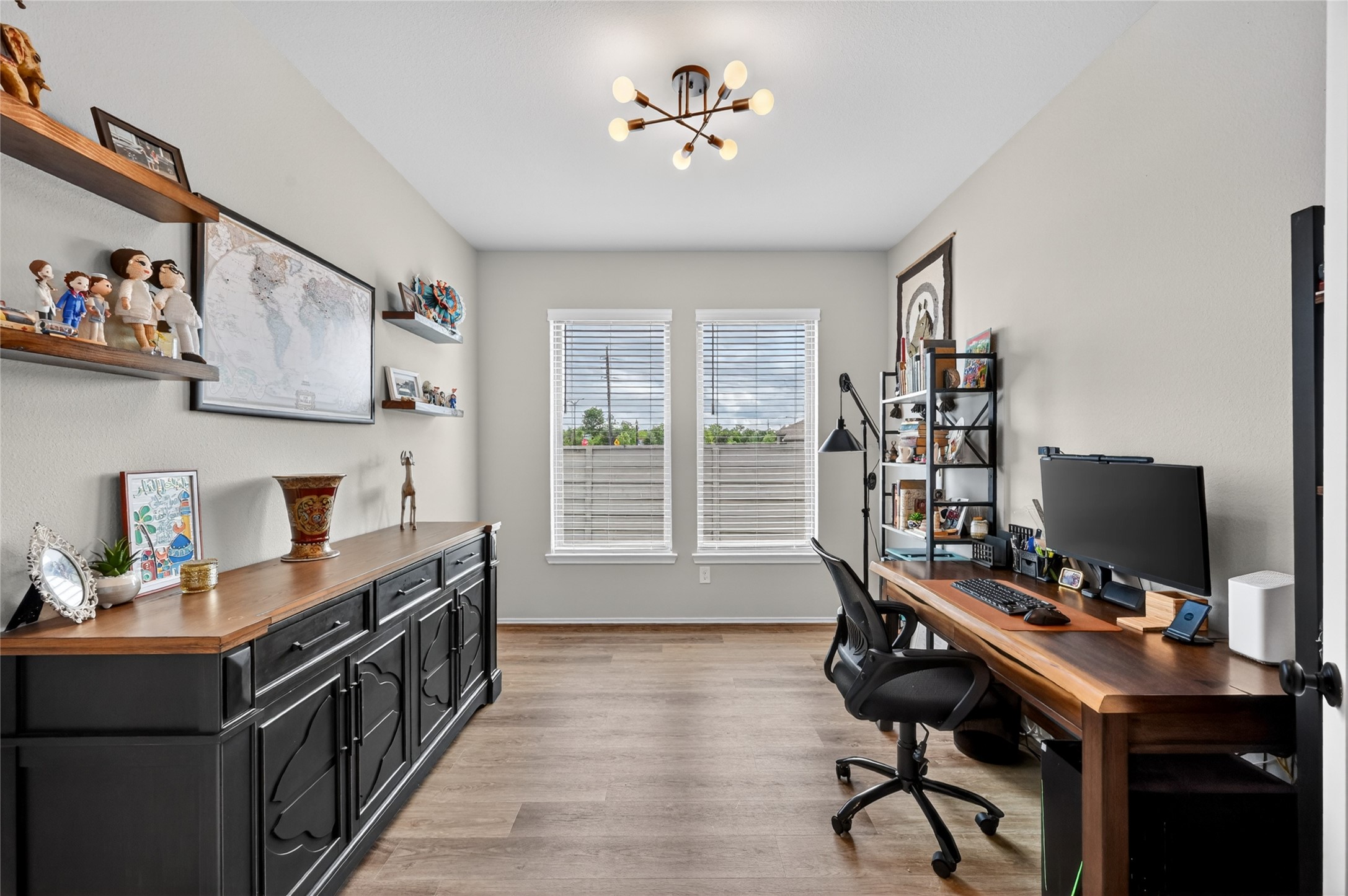 4731 Cedar Butte Lane Manvel, TX 77578 - Photo 6 of 42 a view of a workspace with furniture and a window