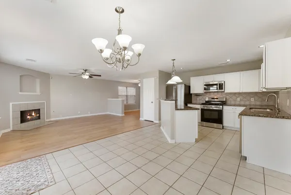 a view of a kitchen with microwave and cabinets