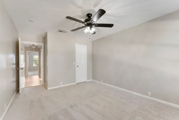 a view of room with ceiling fan