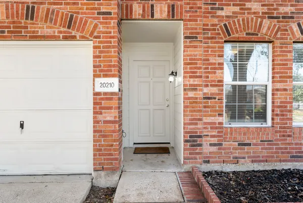 a view of a brick house with a window