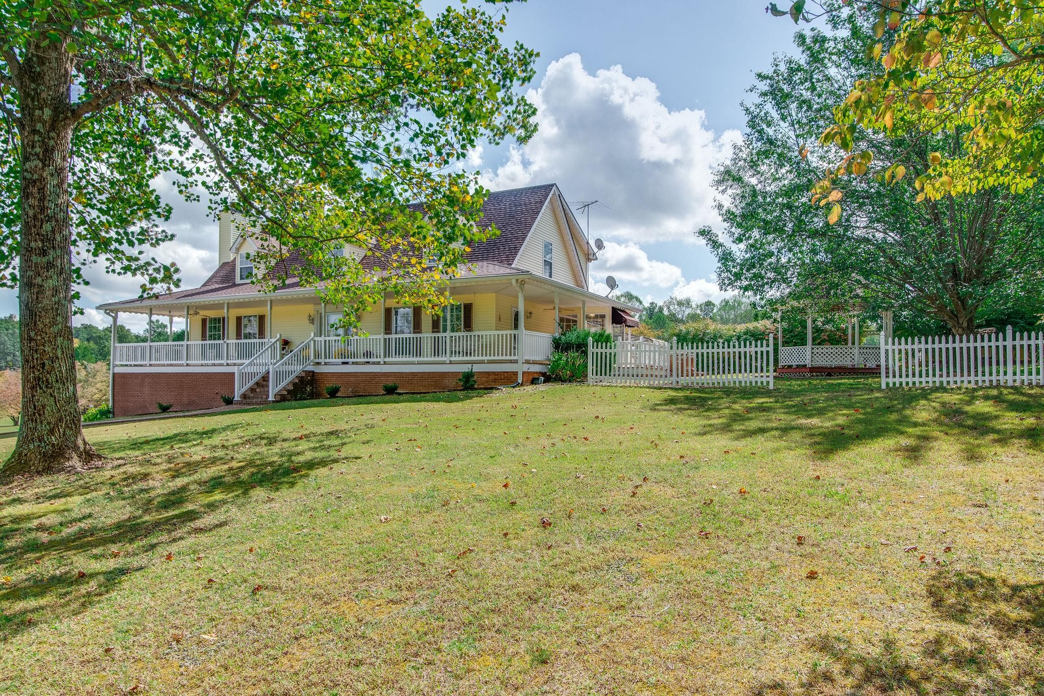 6761 Hall Road Greenbrier, TN 37073 - Photo 5 of 85 a front view of house with yard and green space