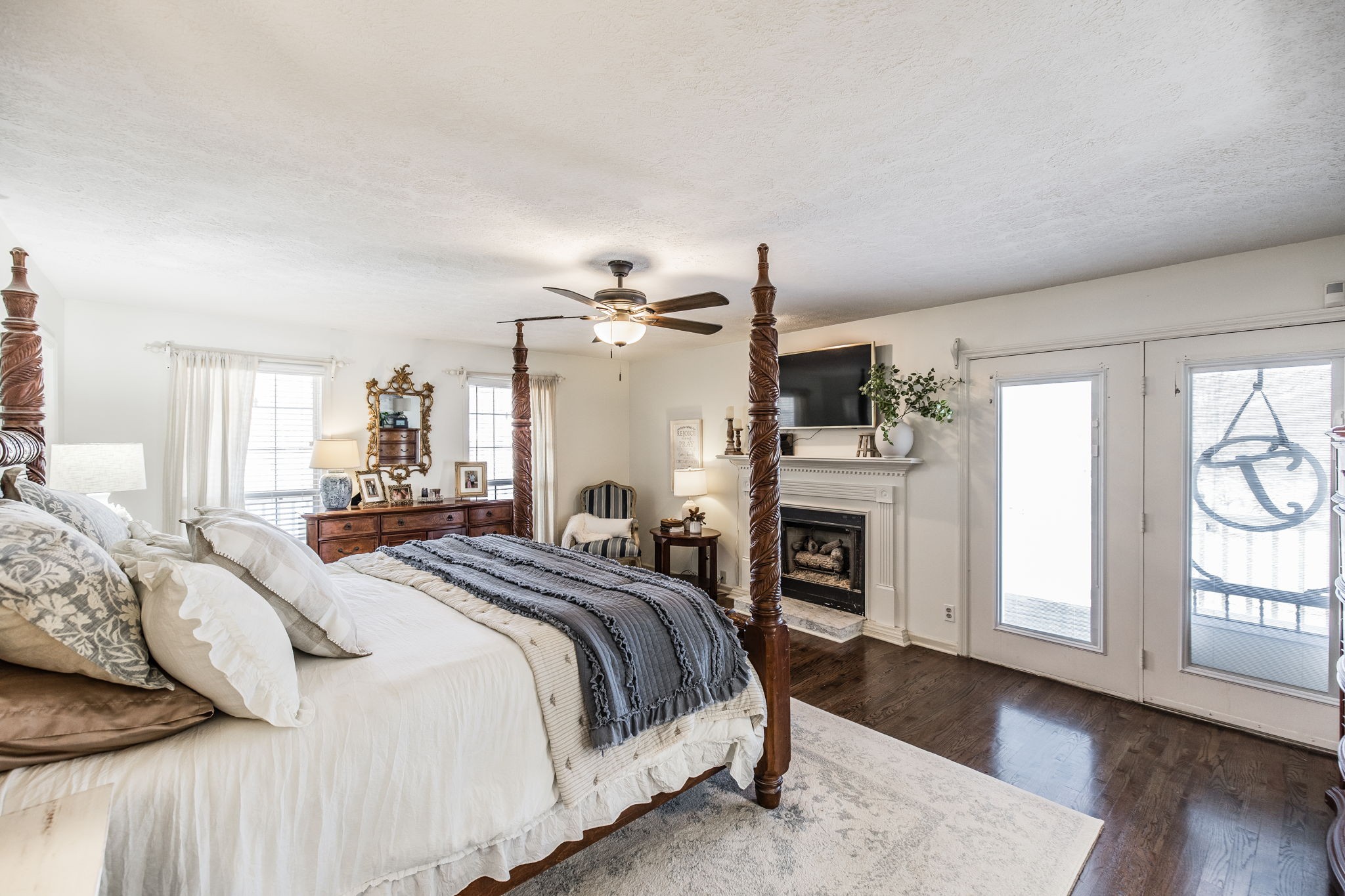 6761 Hall Road Greenbrier, TN 37073 - Photo 59 of 85 a bedroom with a large bed and a fireplace