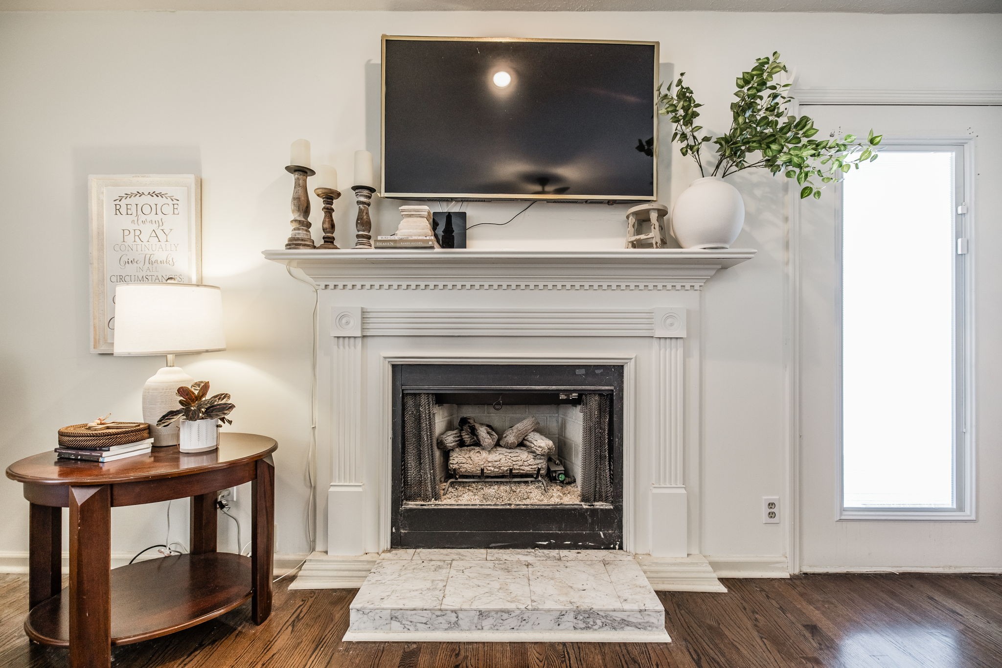 6761 Hall Road Greenbrier, TN 37073 - Photo 62 of 85 a living room with a fireplace and a flat screen tv