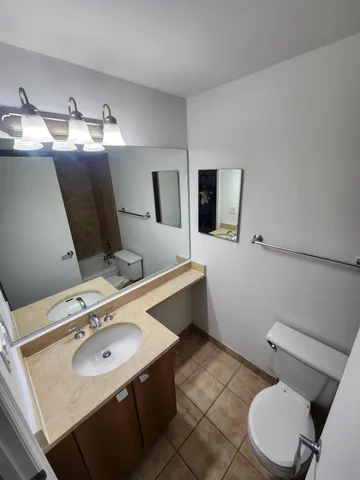 a bathroom with a toilet and a bathtub