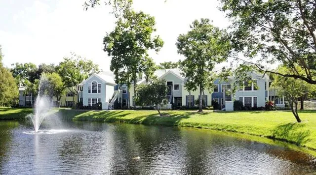 a bathroom with a sink mirror vanity and toilet