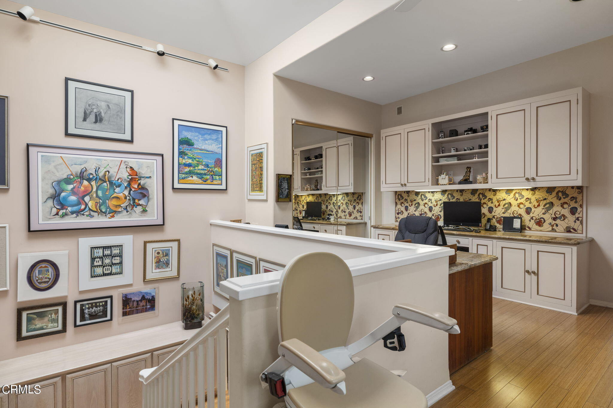 2226 Cannes Square Oxnard, CA 93035 - Photo 30 of 75 a open kitchen with stainless steel appliances granite countertop a stove top oven a sink a refrigerator and white cabinets with wooden floor