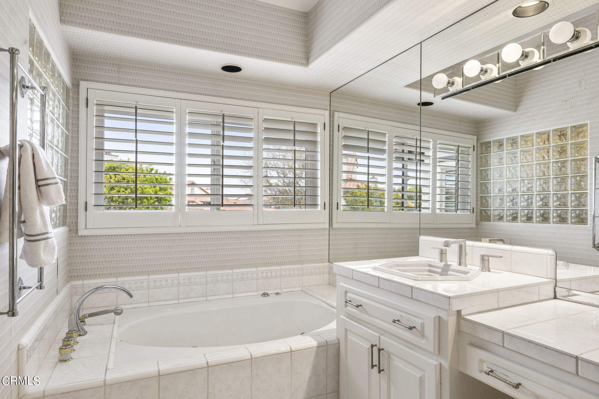 2226 Cannes Square Oxnard, CA 93035 - Photo 37 of 75 a bathroom with a granite countertop sink and large window