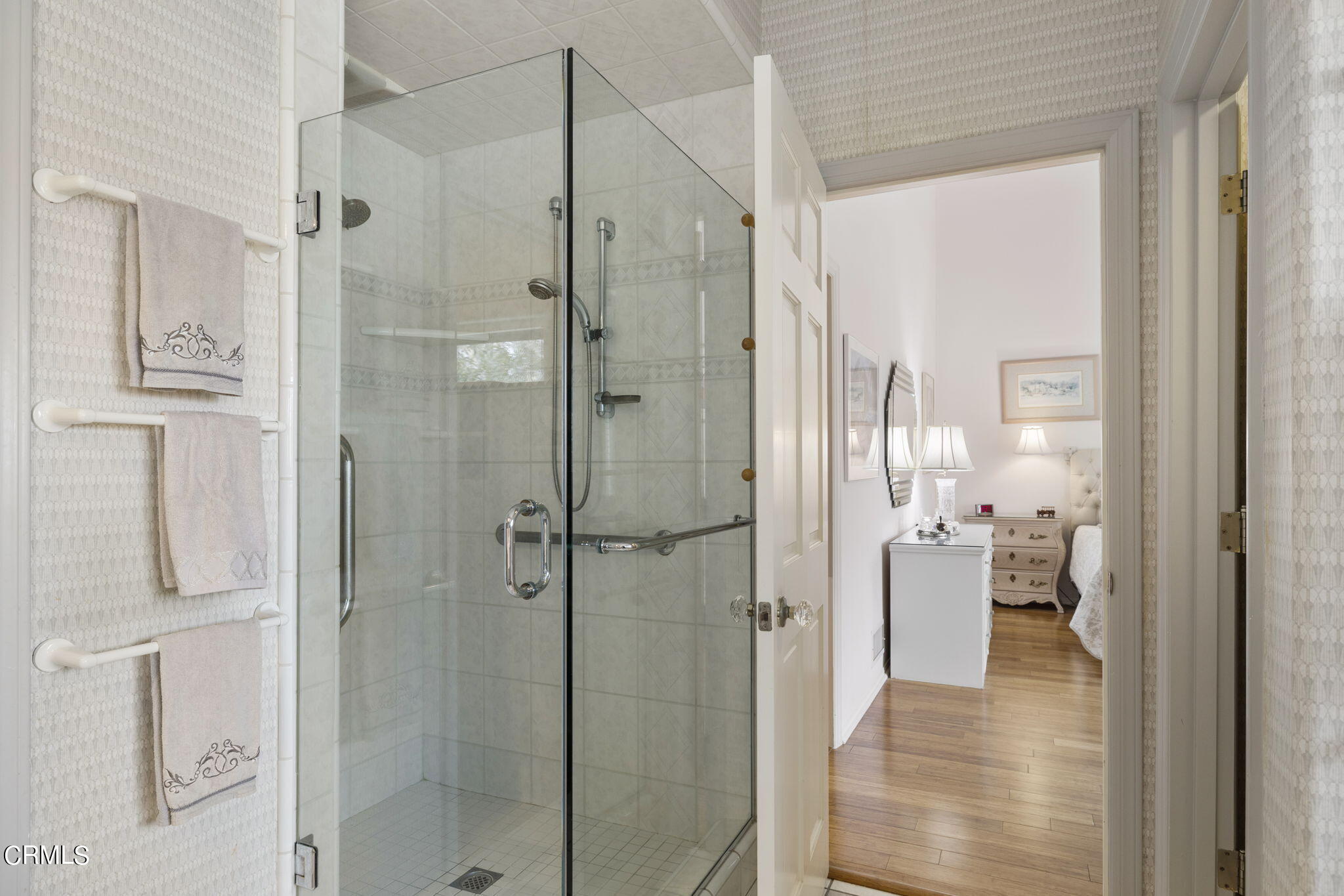 2226 Cannes Square Oxnard, CA 93035 - Photo 38 of 75 a bathroom with a glass shower door
