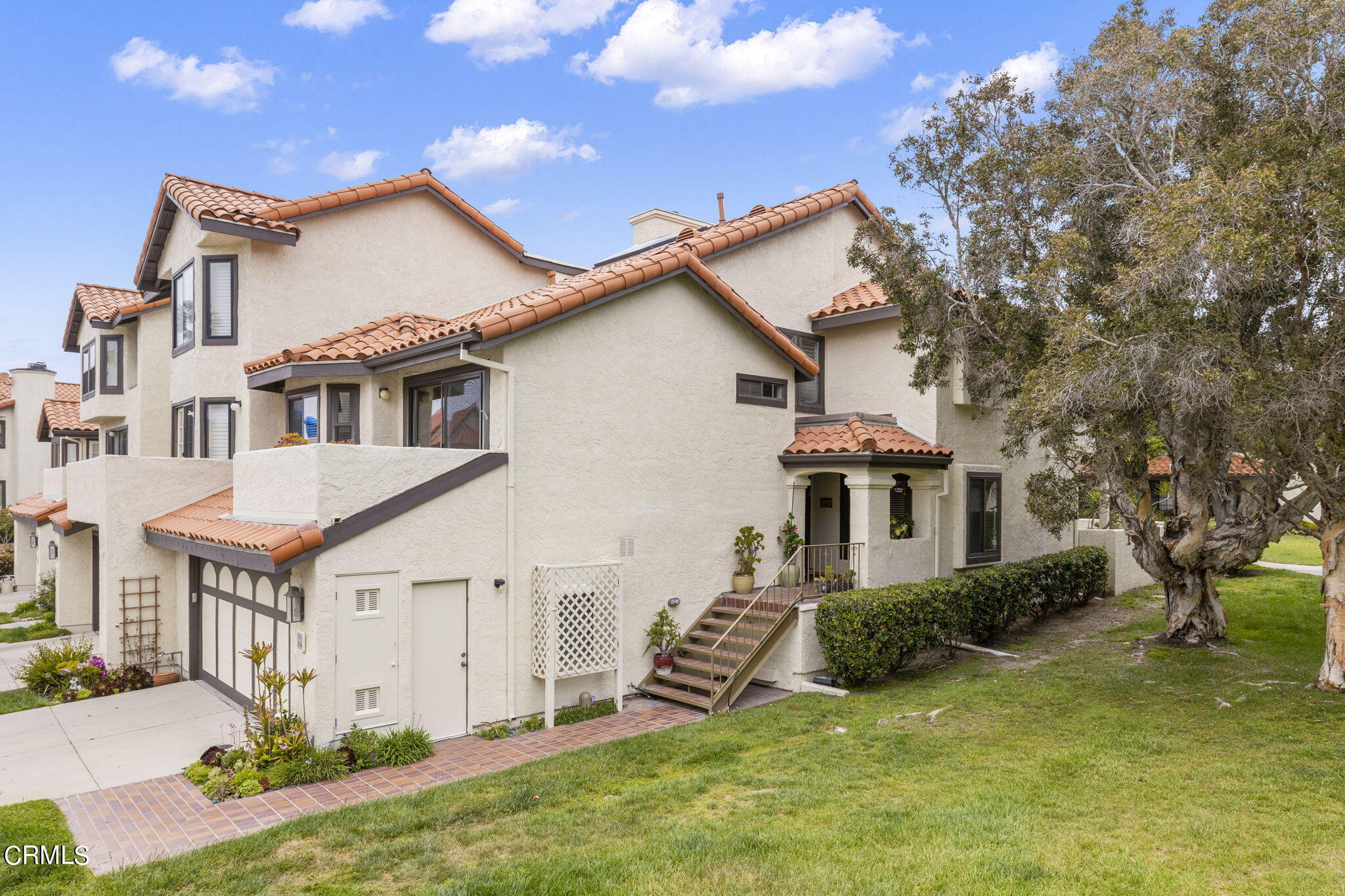 2226 Cannes Square Oxnard, CA 93035 - Photo 5 of 75 a front view of a house with a yard