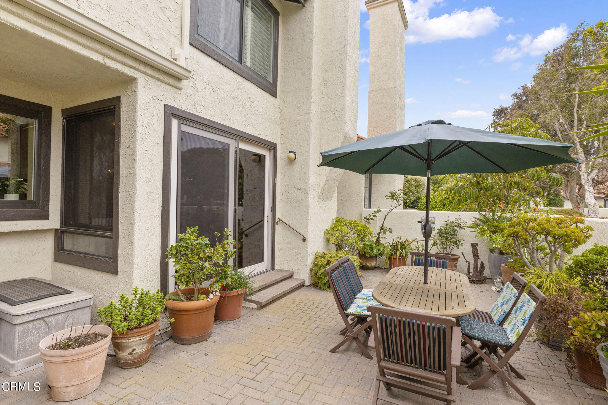 2226 Cannes Square Oxnard, CA 93035 - Photo 56 of 75 a view of a patio with chairs and potted plants