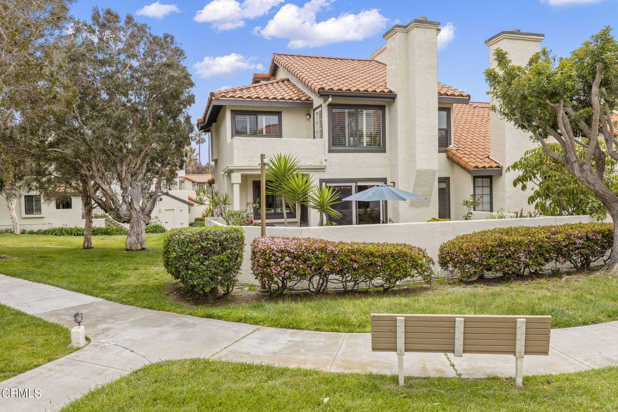 2226 Cannes Square Oxnard, CA 93035 - Photo 7 of 75 a front view of a house with a garden