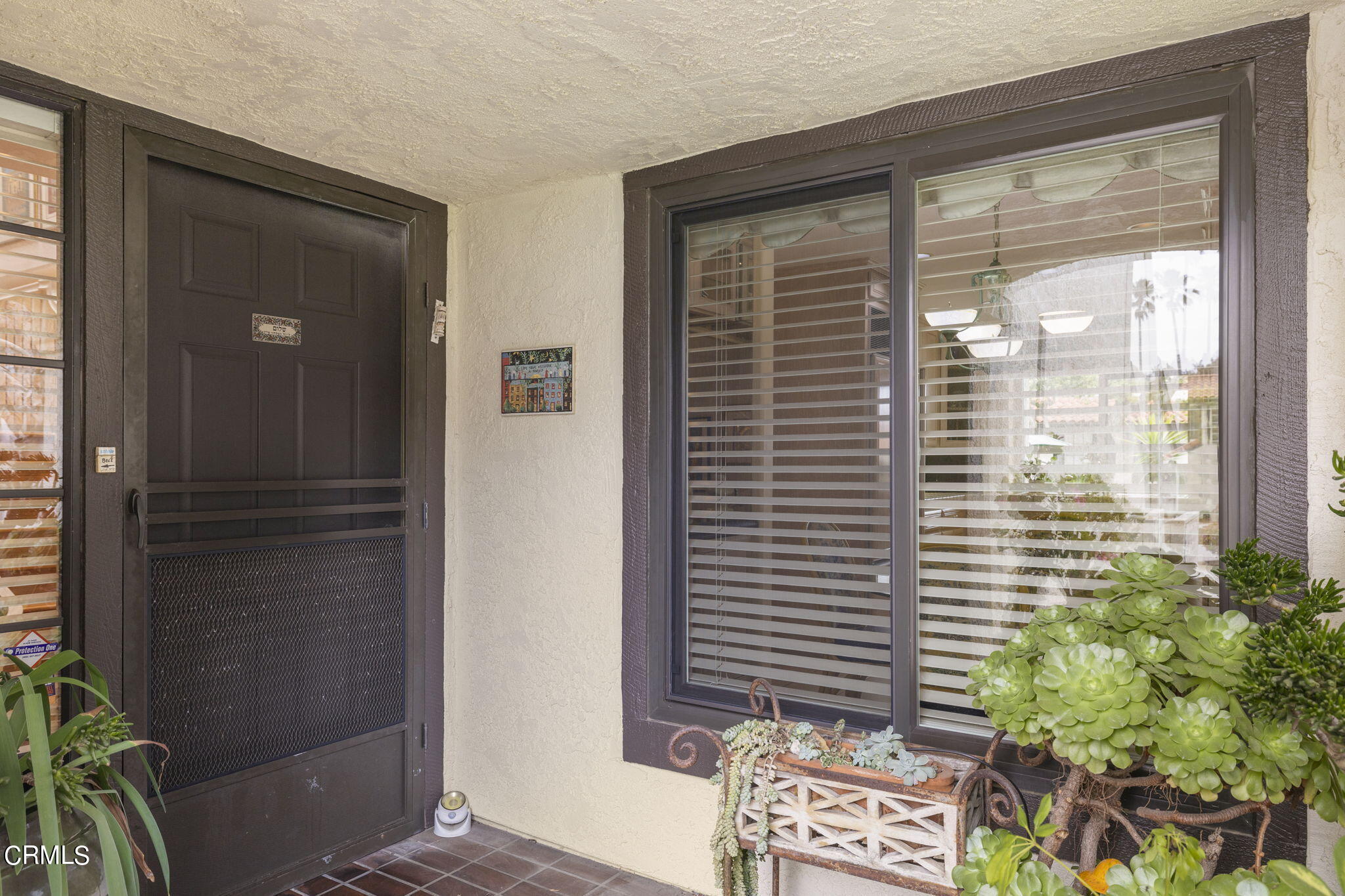 2226 Cannes Square Oxnard, CA 93035 - Photo 9 of 75 a view of a balcony with a potted plant