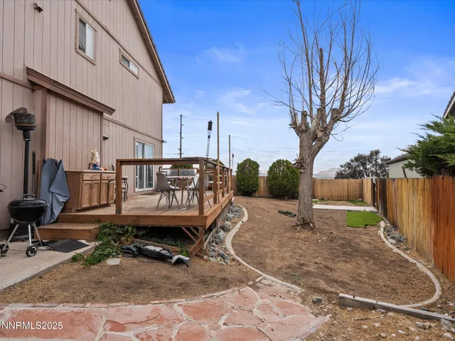 a view of a backyard with sitting area