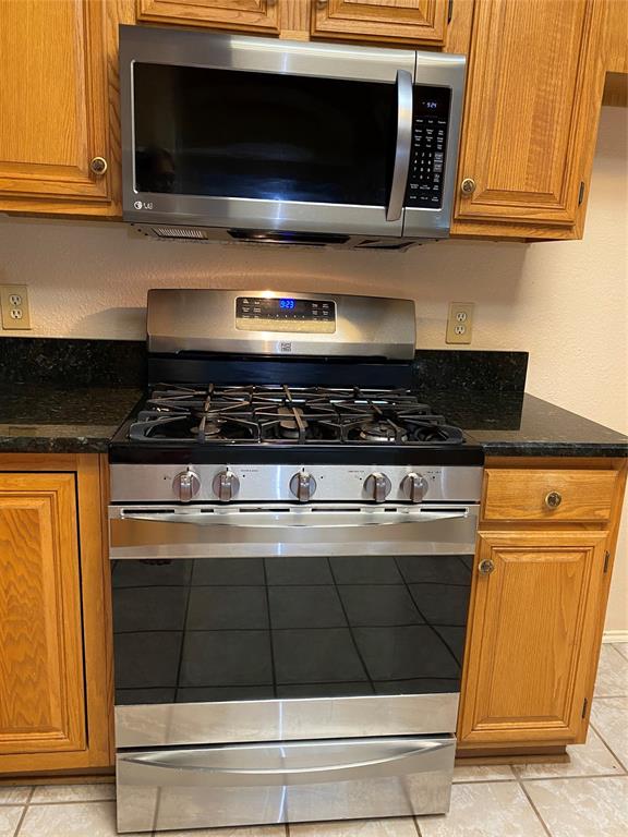 1924 Sunset Path Lewisville, TX 75067 - Photo 11 of 37 a stove top oven sitting inside of a kitchen