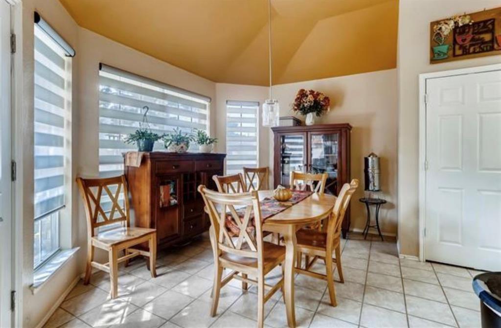 1924 Sunset Path Lewisville, TX 75067 - Photo 14 of 37 a view of a dining room with furniture and a window