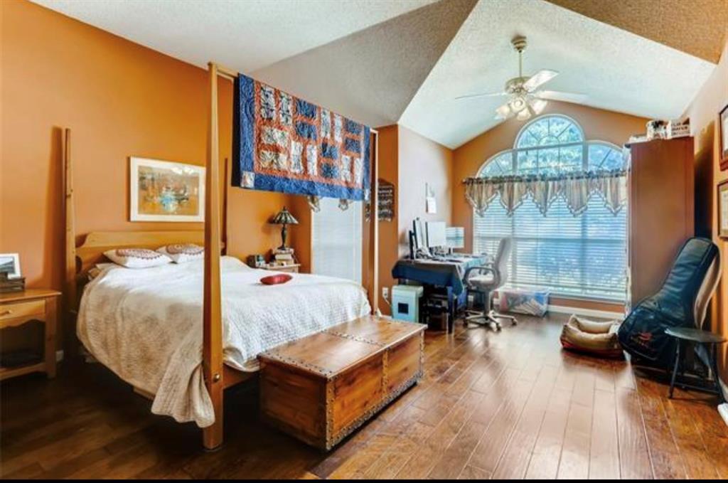 1924 Sunset Path Lewisville, TX 75067 - Photo 16 of 37 a bed room with furniture and a chandelier