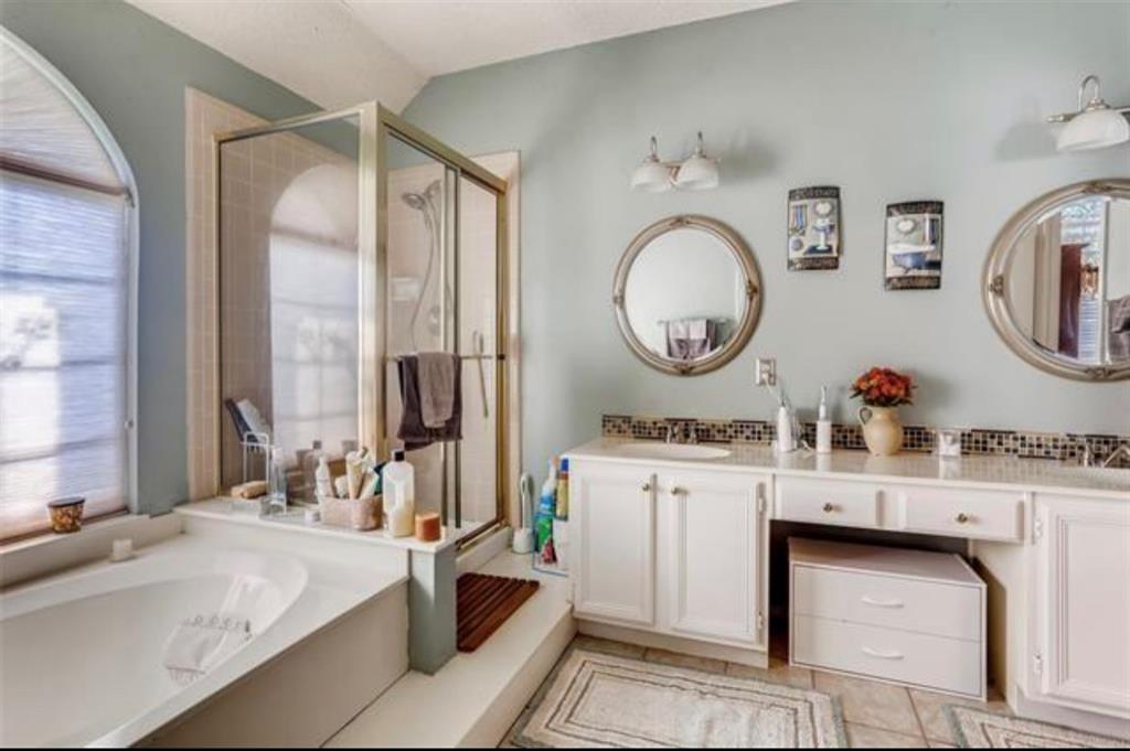 1924 Sunset Path Lewisville, TX 75067 - Photo 21 of 37 a very nice looking room with a large window and a clock