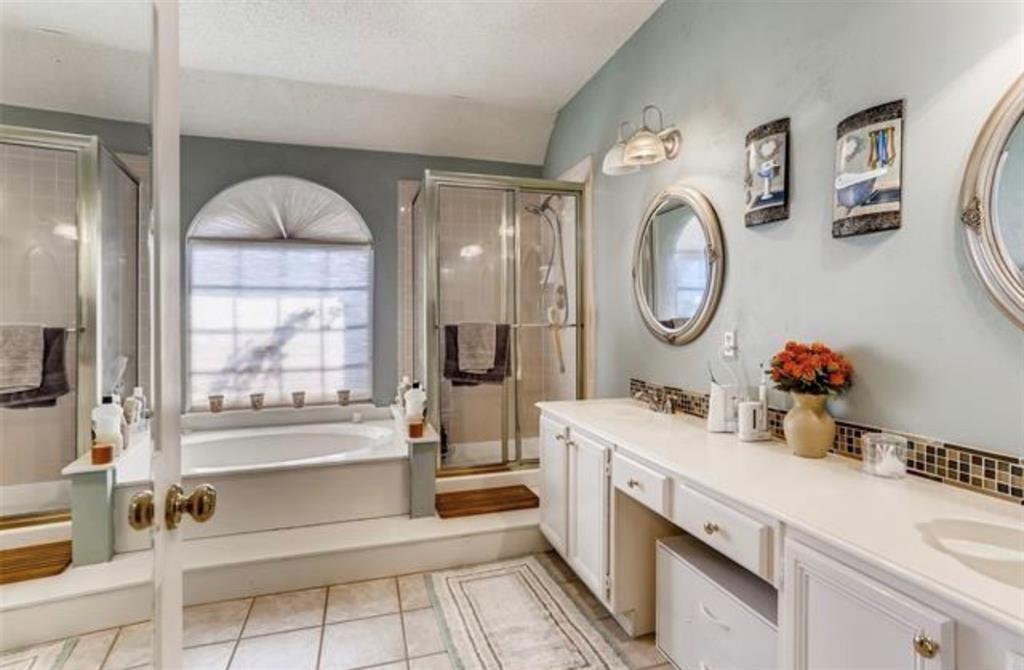 1924 Sunset Path Lewisville, TX 75067 - Photo 22 of 37 a bathroom with a double vanity sink mirror and bathtub