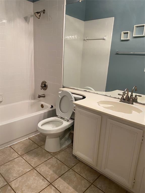 1924 Sunset Path Lewisville, TX 75067 - Photo 27 of 37 a bathroom with a granite countertop sink a toilet a mirror and bathtub