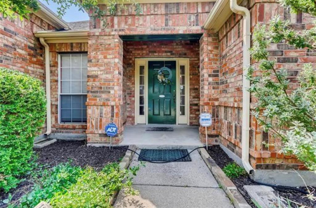1924 Sunset Path Lewisville, TX 75067 - Photo 3 of 37 a front view of a house with a yard