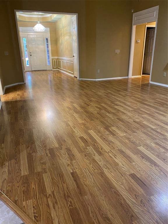 1924 Sunset Path Lewisville, TX 75067 - Photo 6 of 37 wooden floor in an empty room with a window