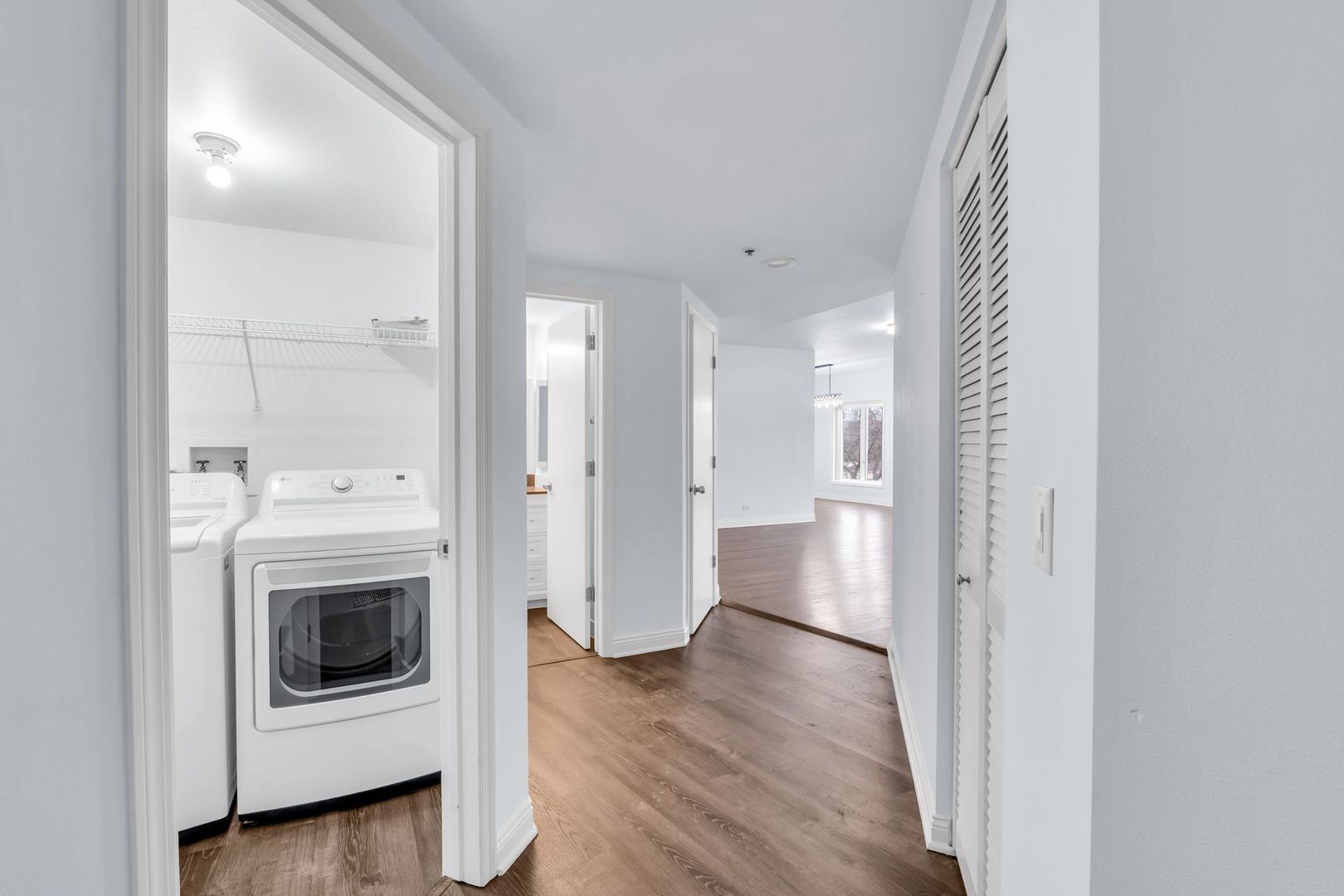 1330 Perry Street, Unit 504 Des Plaines, IL 60016 - Photo 2 of 32 a view of a hallway with wooden floor and a sink