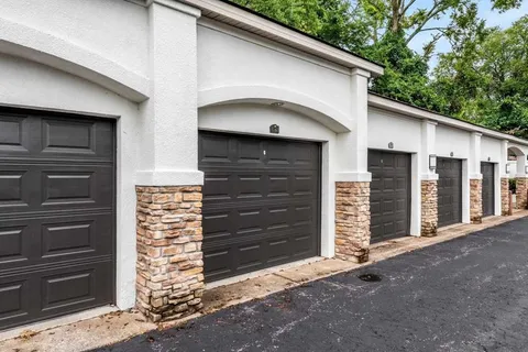 a front view of a house with a gate