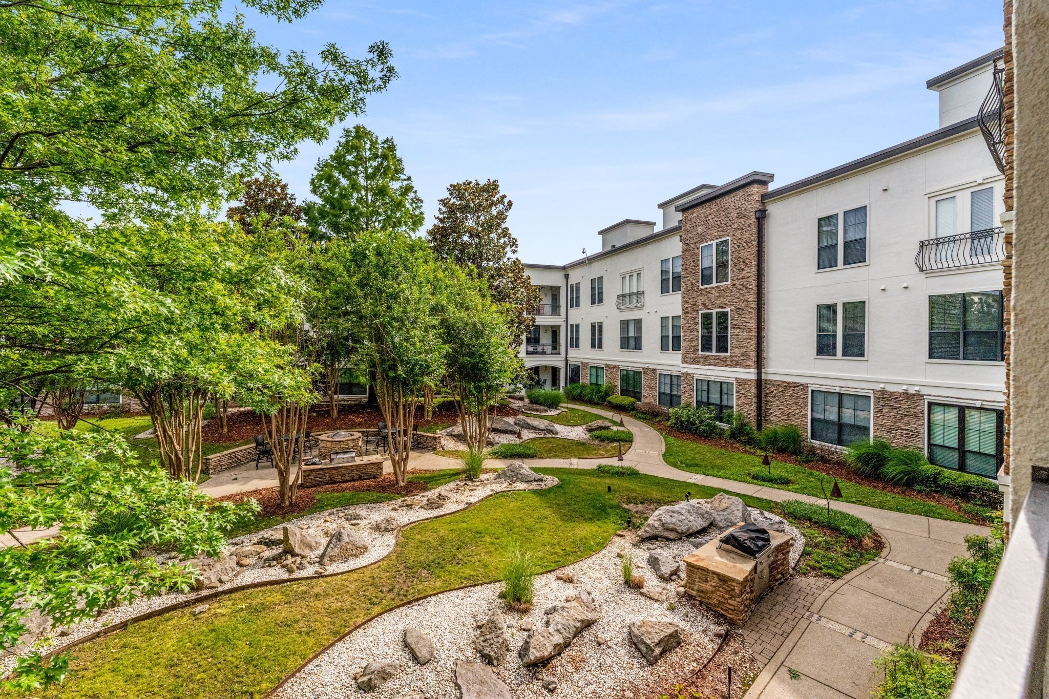 2600 Hillsboro Pike, Unit 115 Nashville, TN 37212 - Photo 17 of 29 a view of a house with swimming pool and sitting area