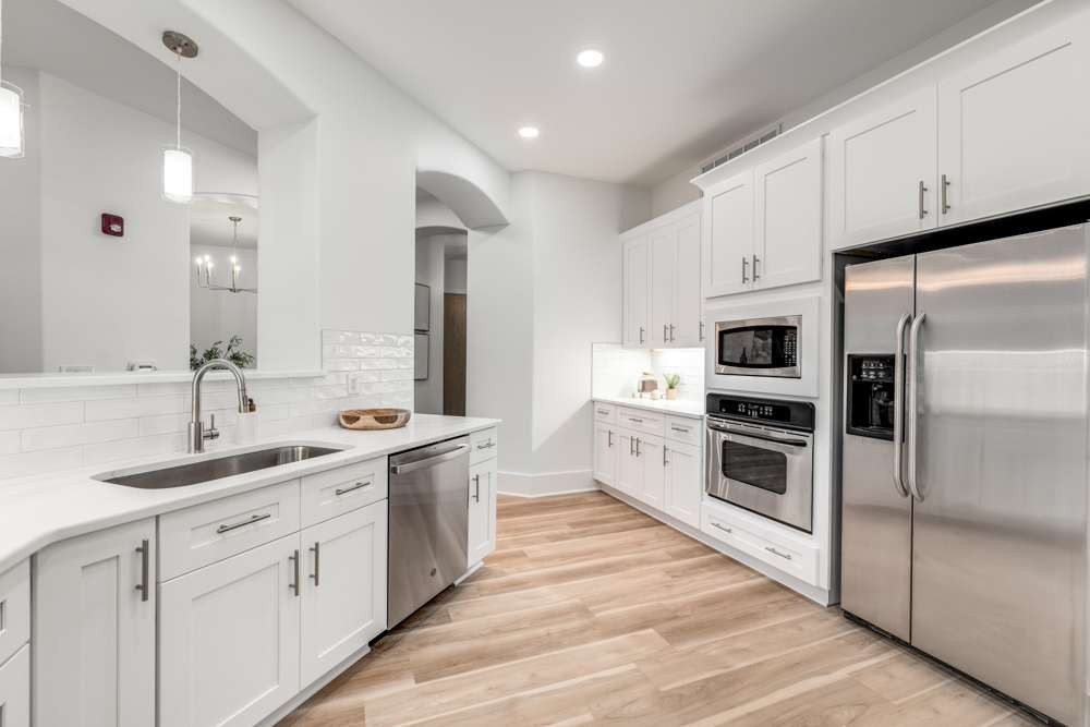 2600 Hillsboro Pike, Unit 115 Nashville, TN 37212 - Photo 5 of 29 a kitchen with white cabinets and white appliances