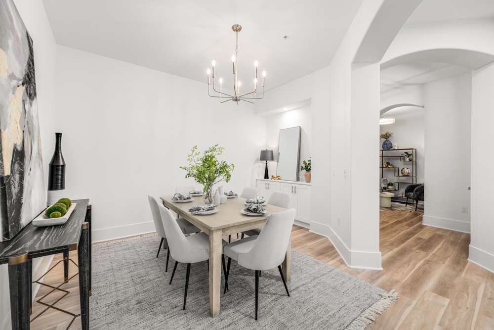 2600 Hillsboro Pike, Unit 115 Nashville, TN 37212 - Photo 6 of 29 a view of a dining room with furniture and wooden floor
