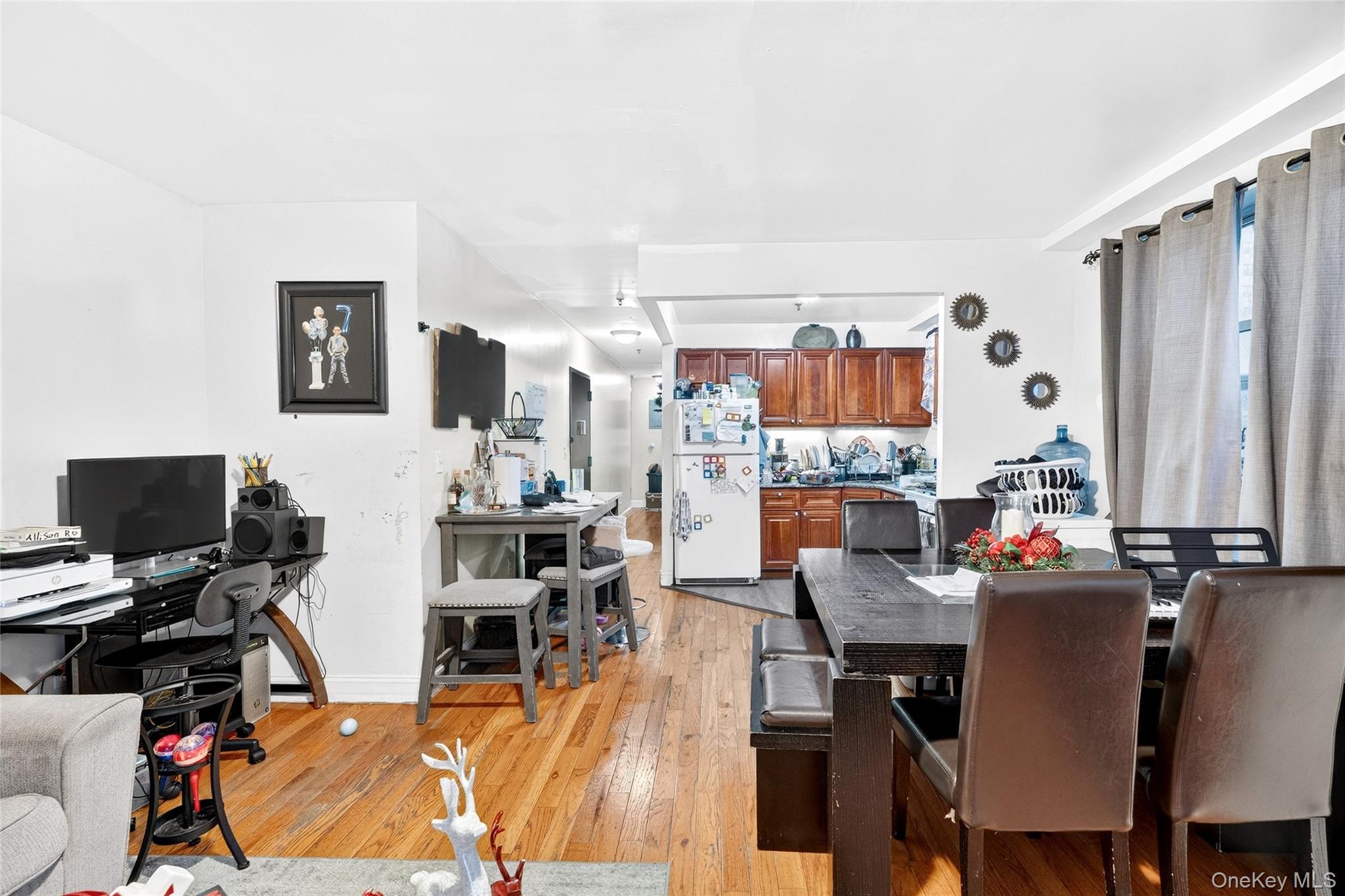 1459 Rosedale Avenue Bronx, NY 10460 - Photo 16 of 37 a view of a dining room with furniture and a window