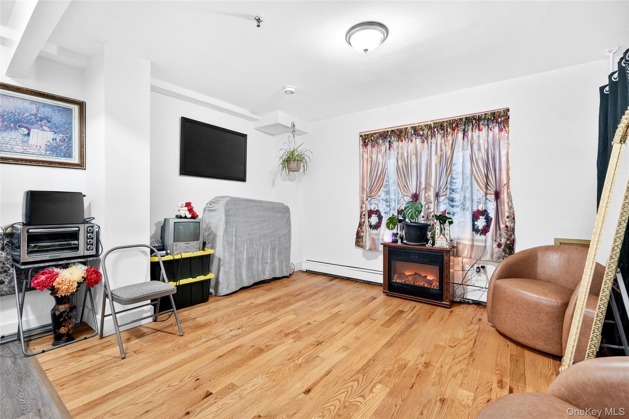 1459 Rosedale Avenue Bronx, NY 10460 - Photo 23 of 37 a living room with furniture and a flat screen tv